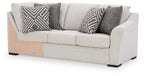 Koralynn Raf sofa with corner wedge in light gray with patterned throw pillows
