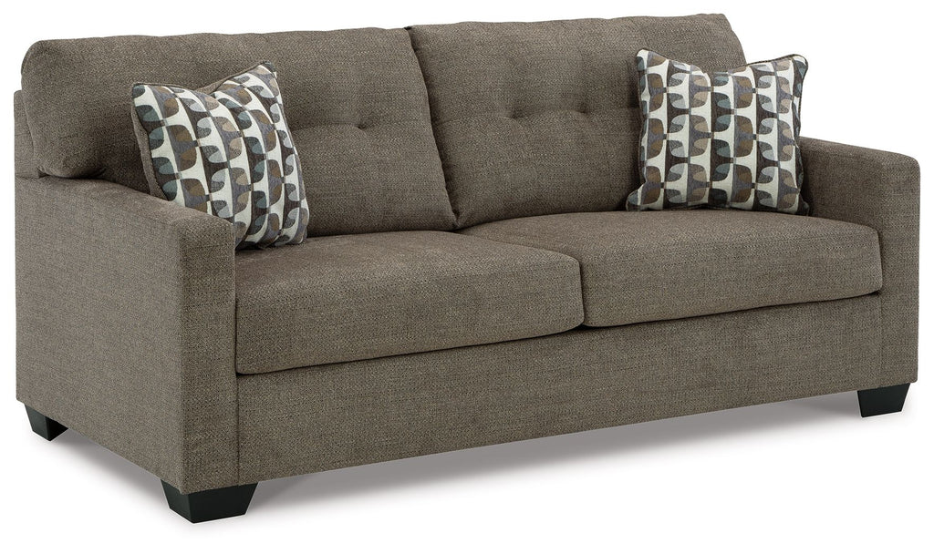 Dark gray sofa with two seat cushions and two patterned throw pillows