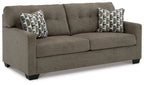 Dark gray sofa with two seat cushions and two patterned throw pillows