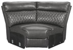 Gray wedge sectional seat with diamond quilting and padded armrests