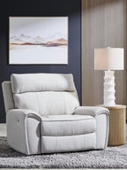 Light gray power recliner chair with tall padded back and cushioned seat