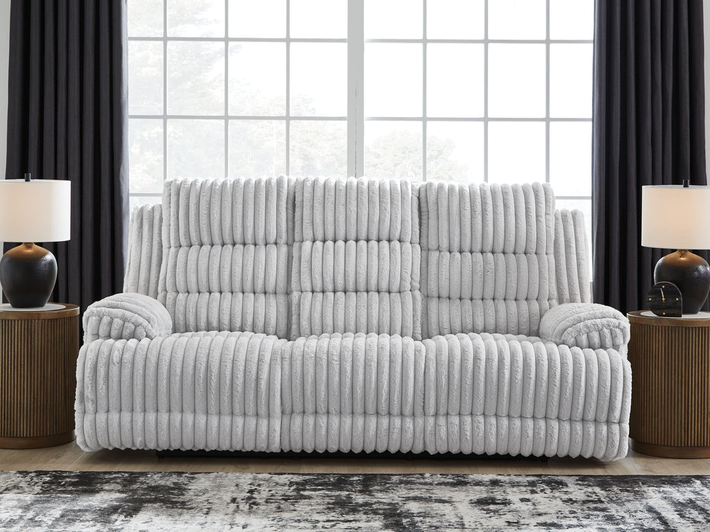 Reclining power sofa with drop-down table, light gray ribbed upholstery, reclined chaise