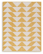 Yellow and white chevron patterned rug with zigzag rows