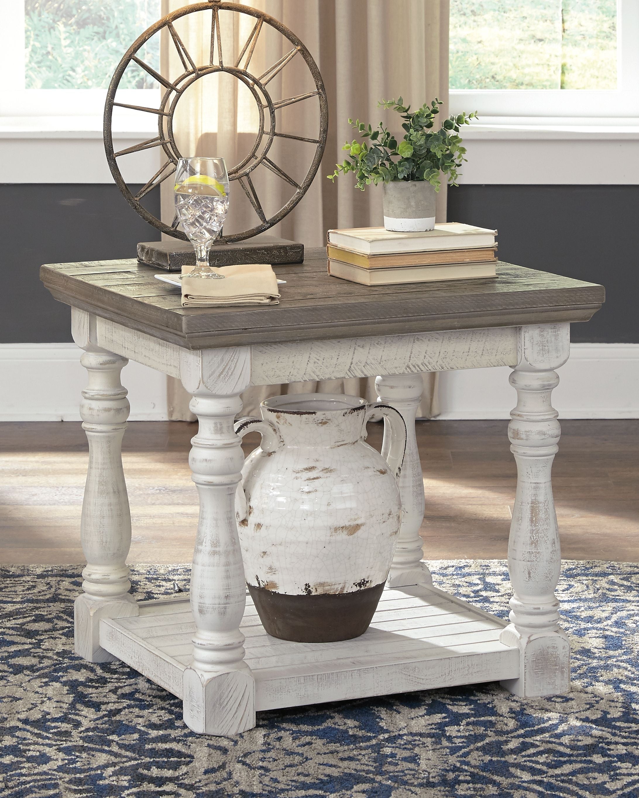 Rectangular end table with gray tabletop, white turned legs, and lower shelf