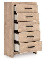 Five-drawer chest in light tan wood with five black bar pulls, drawers ajar