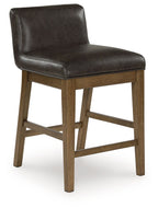 Dark brown upholstered barstool with padded back and seat, light wood legs