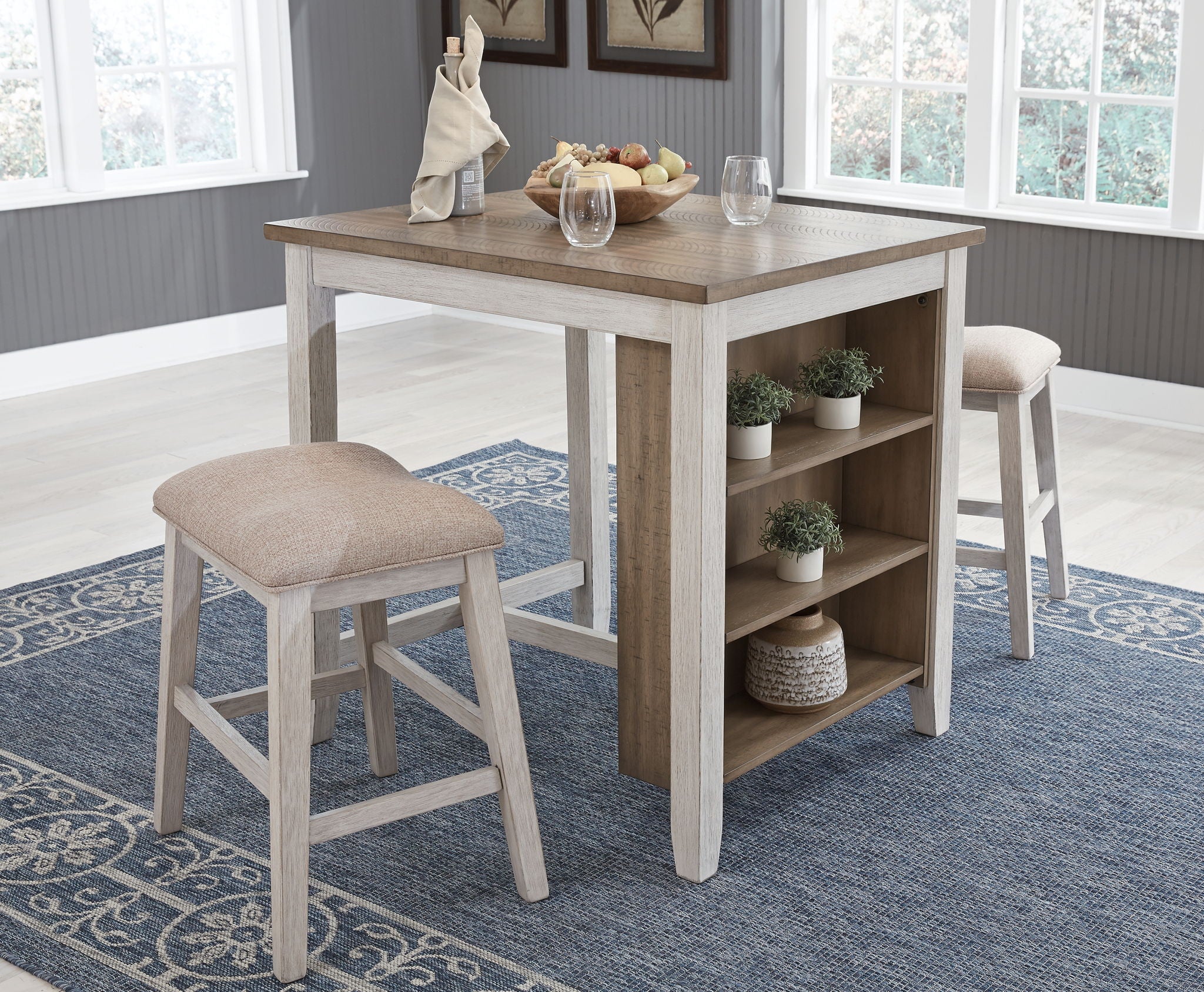 Counter-height rectangular table with open shelving and beige stool, front view