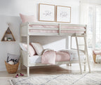 Antique white twin over twin bunk bed with ladder and pink-and-white bedding