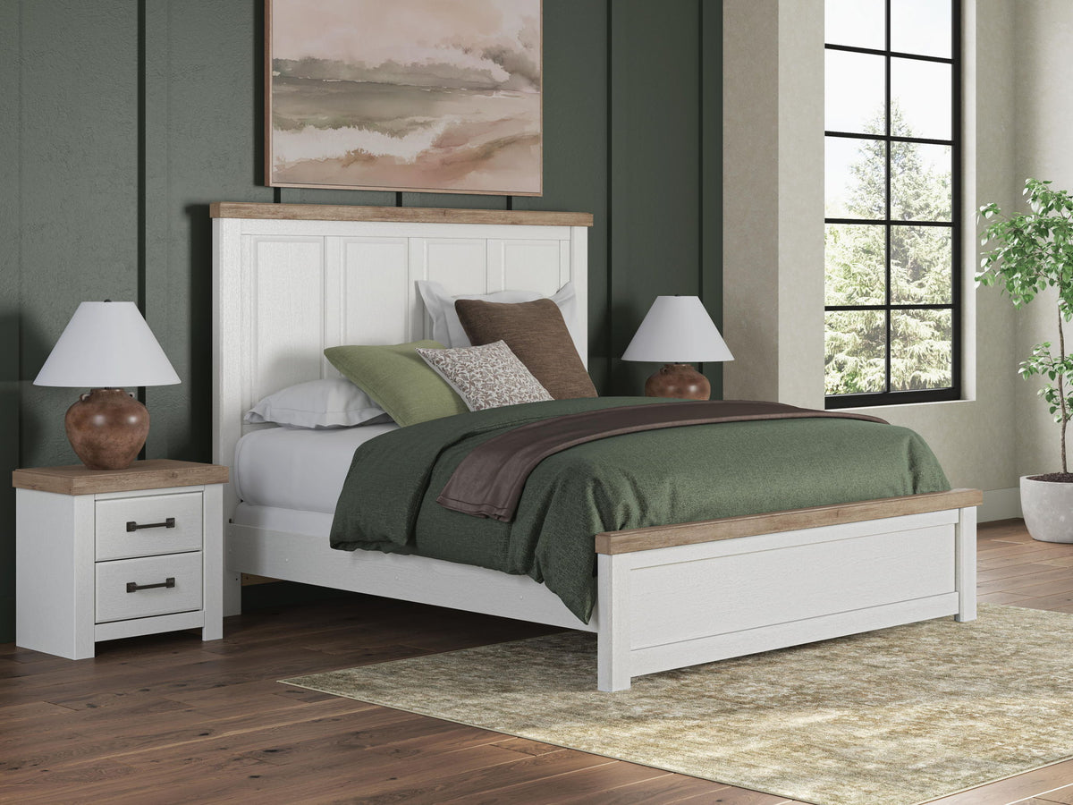 White panel bed with wood trim, showing headboard panels and platform base.