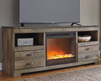 Dark brown TV stand with central fireplace insert, side drawers, and open media shelf