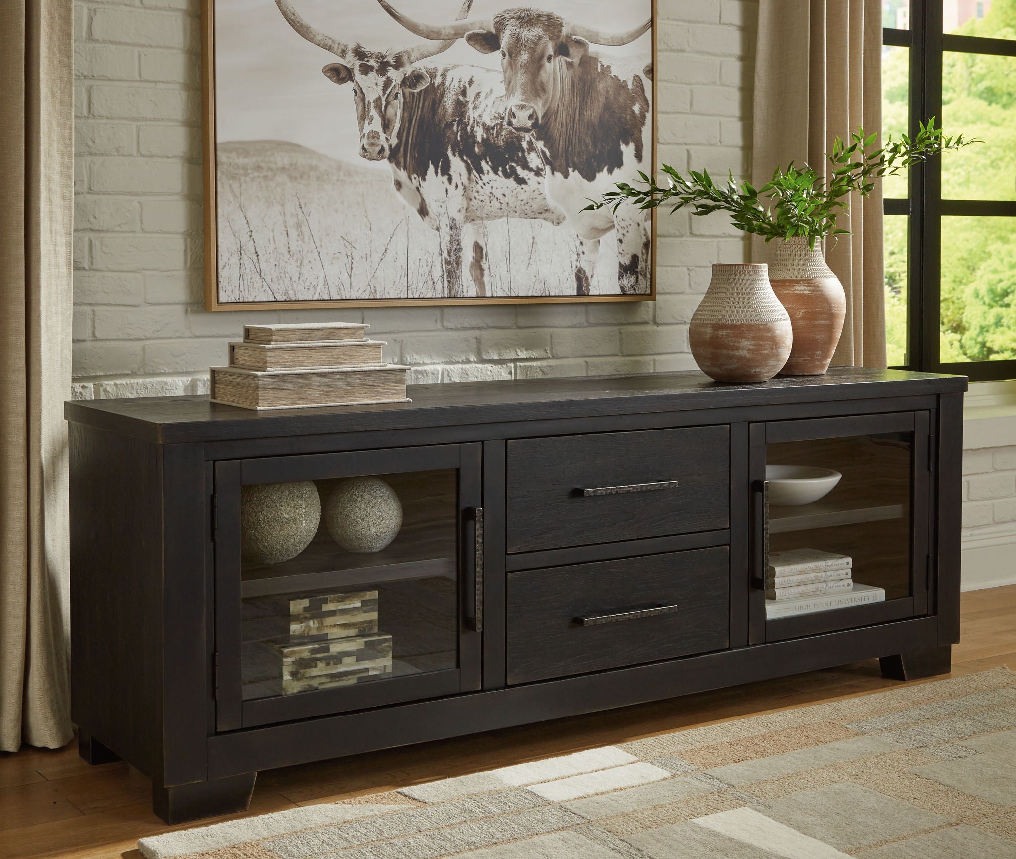 Extra large black TV stand with open shelves, two drawers, and glass cabinet doors