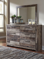 Bedroom dresser with mirror and distressed dark wood drawers with bar pulls