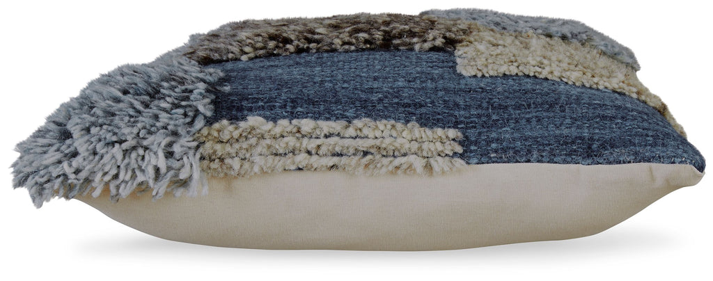 Patchwork throw pillow side view with blue and tan bands and gray fringe