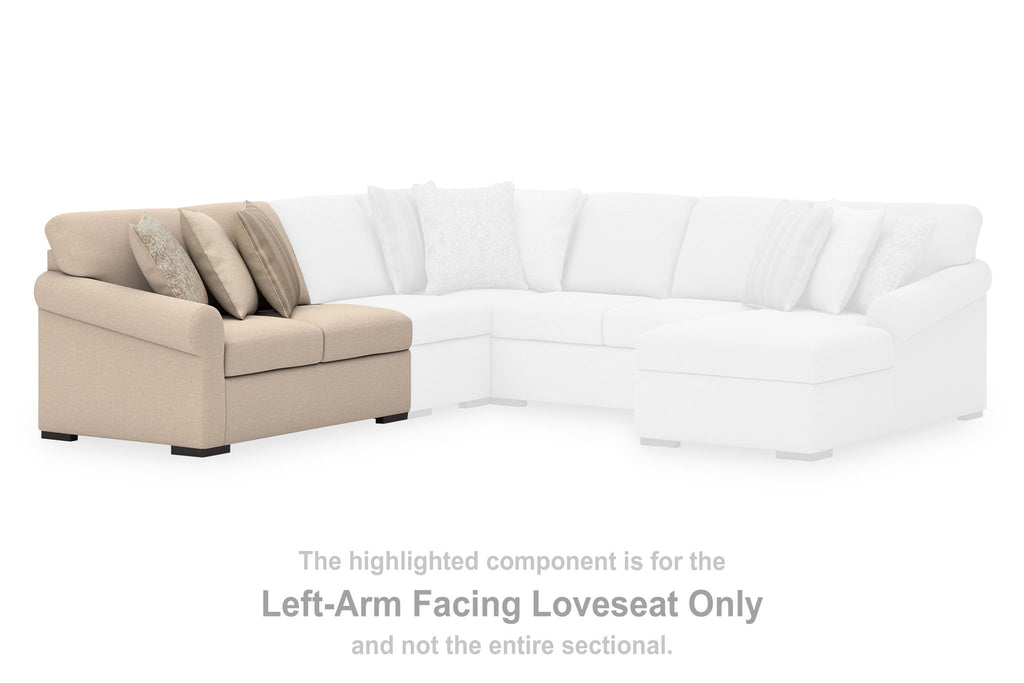 White sectional corner with left-arm loveseat and visible accent pillows on light fabric