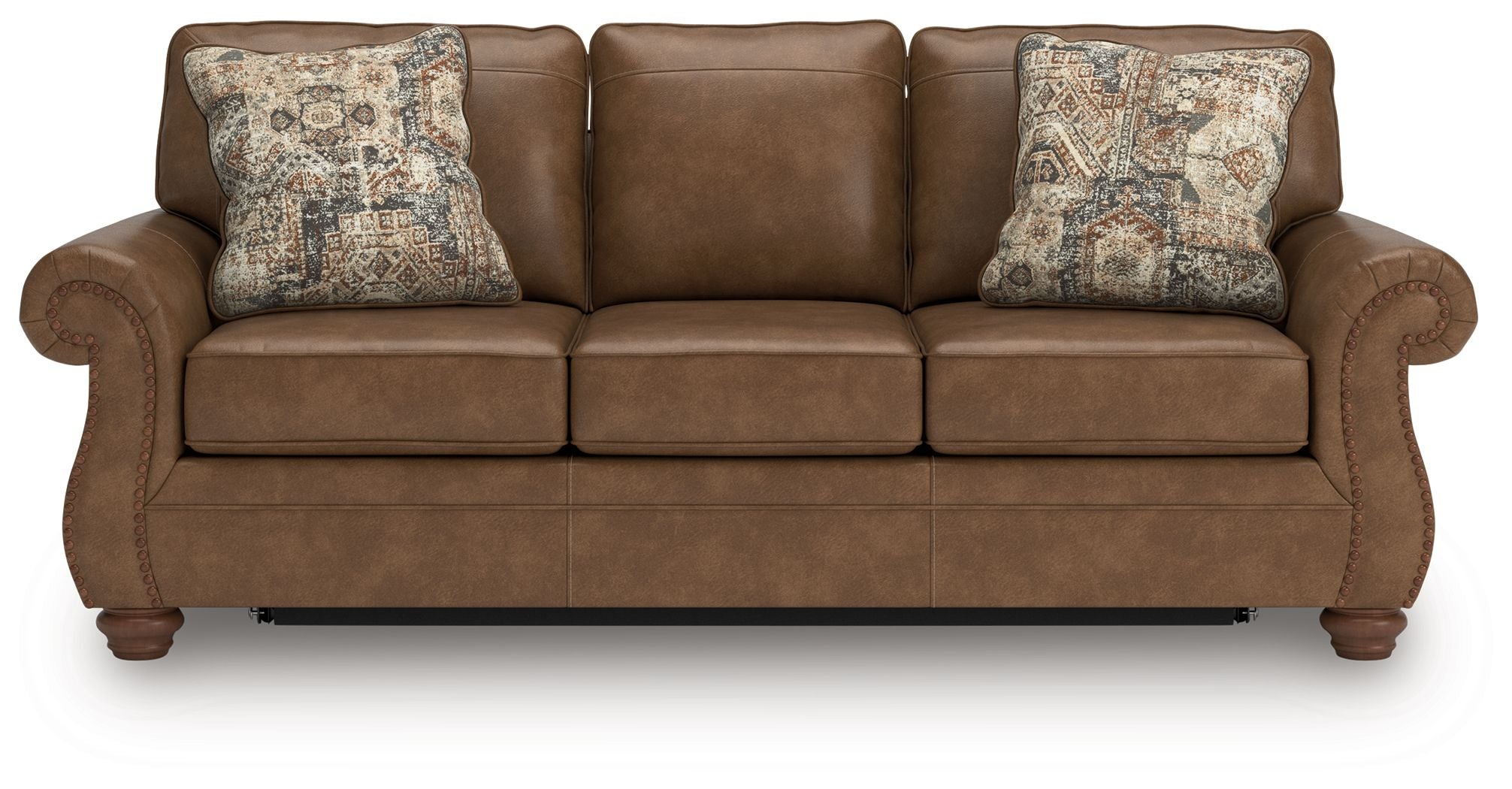 Dark brown sofa sleeper with three seat cushions and two patterned throw pillows