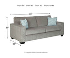 Gray fabric sofa with three seat cushions and patterned accent pillows (85 in wide)