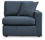 Dark navy upholstered corner chair with two large back cushions and square arms