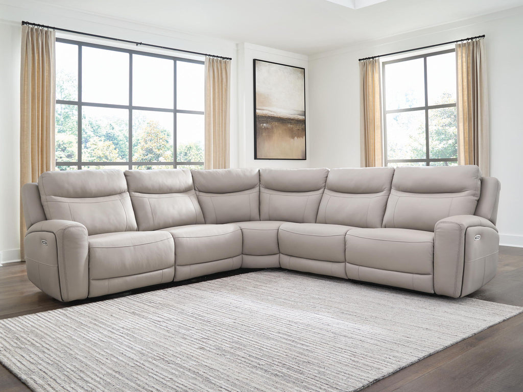 Gray power reclining sectional sofa with cushioned back and padded end armrests