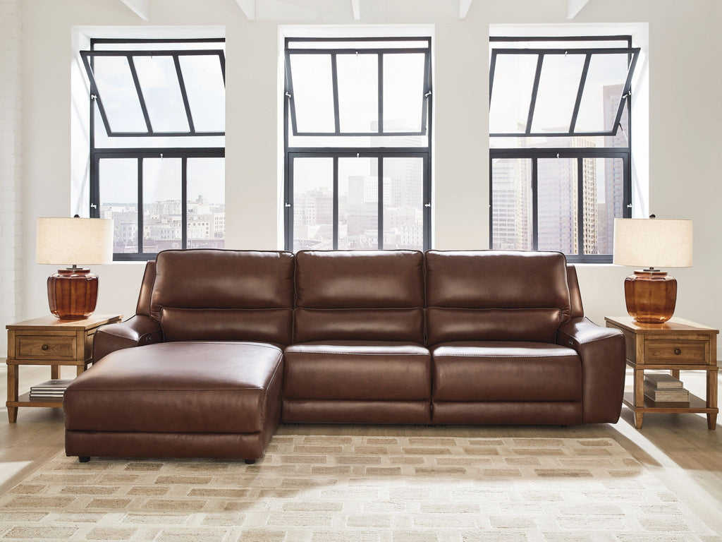 Power reclining sectional in dark brown faux leather with chaise footrest panels