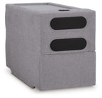 Gray upholstered console with two black speaker-style openings and top hole