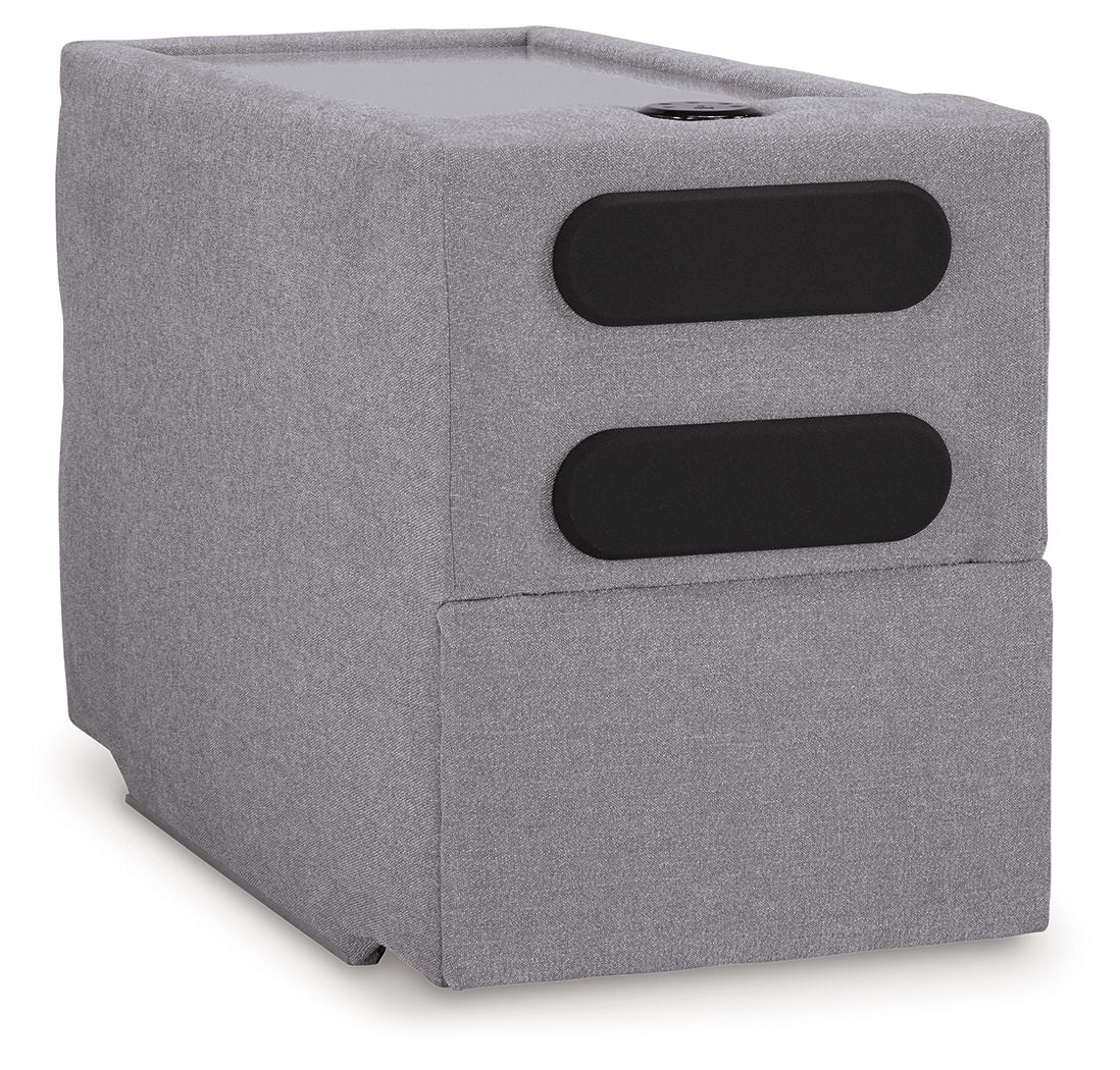 Gray upholstered console with two black speaker-style openings and top hole