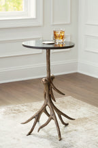 Round black accent table with antique gold curved tripod legs and tabletop tray