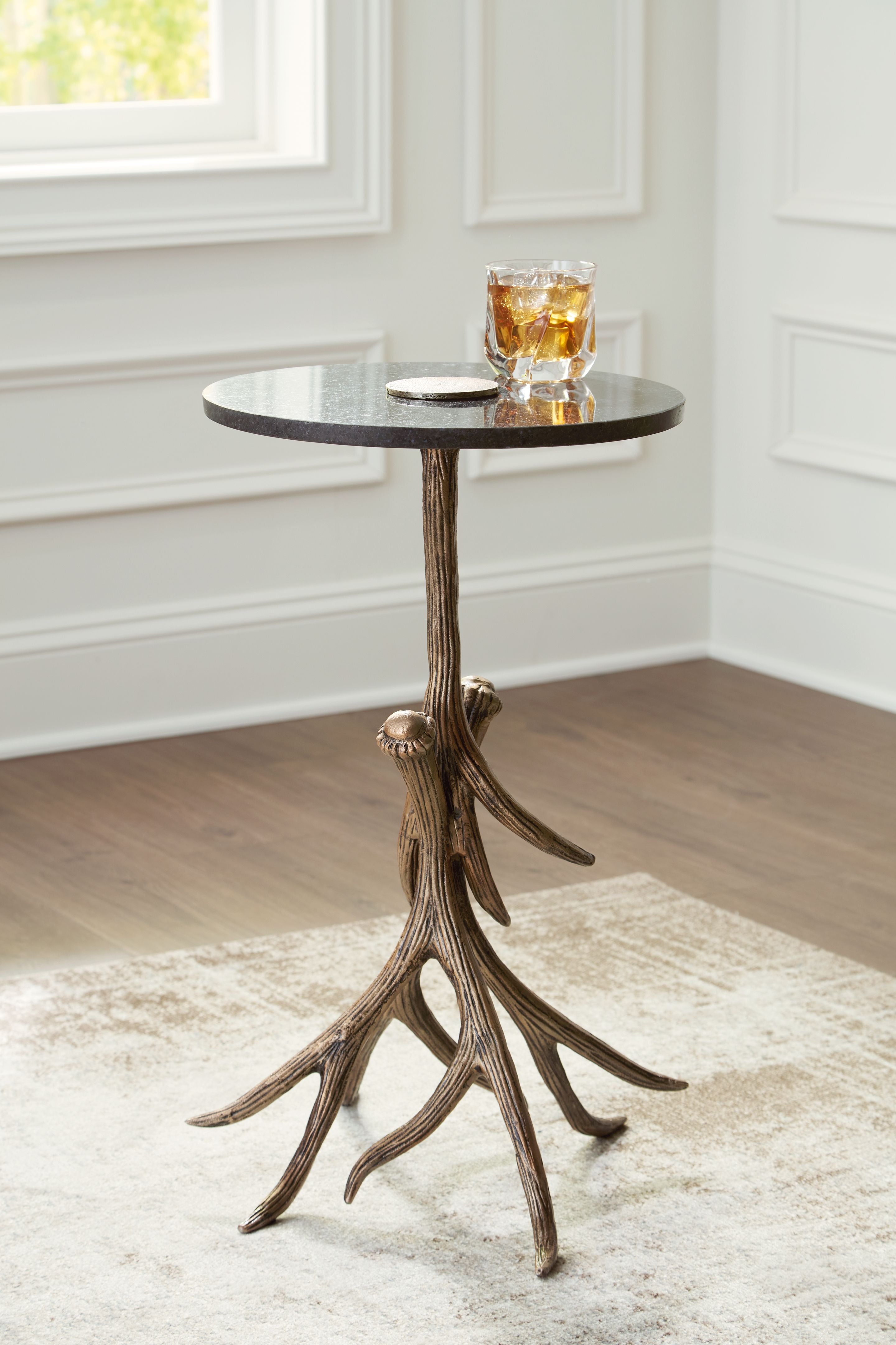 Round black accent table with antique gold curved tripod legs and tabletop tray