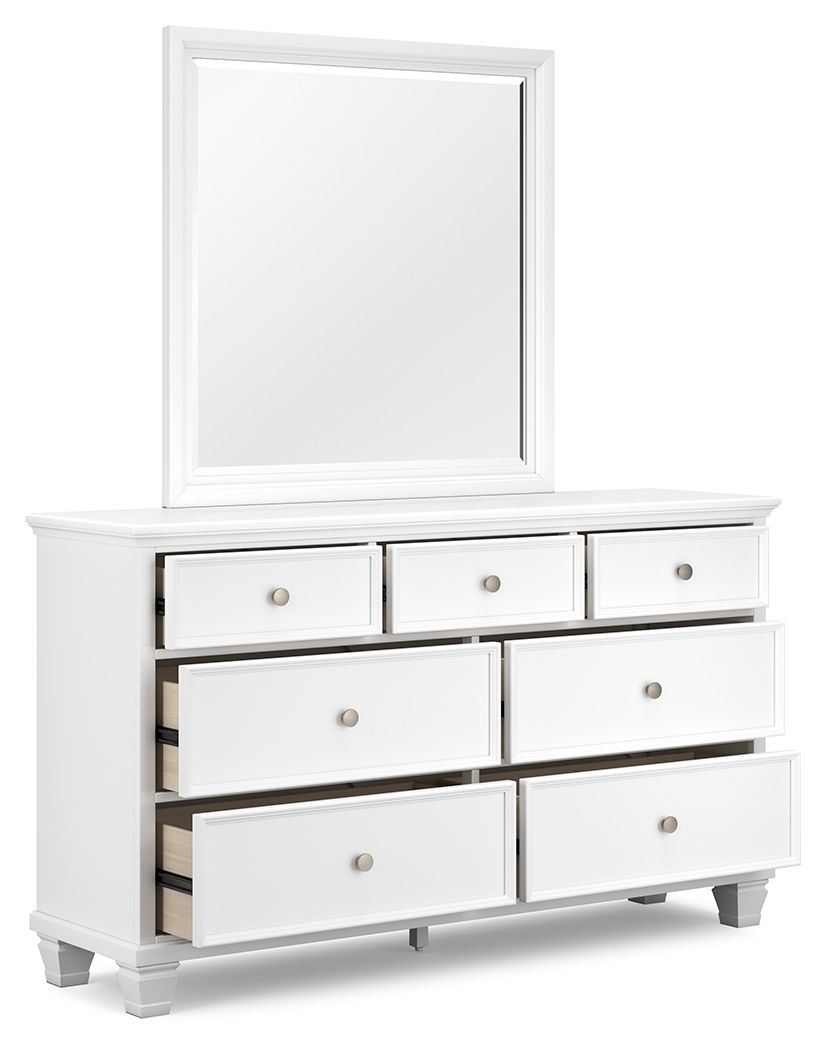 White dresser with mirror and drawer fronts, open cubbies with dark backing, metal knobs.
