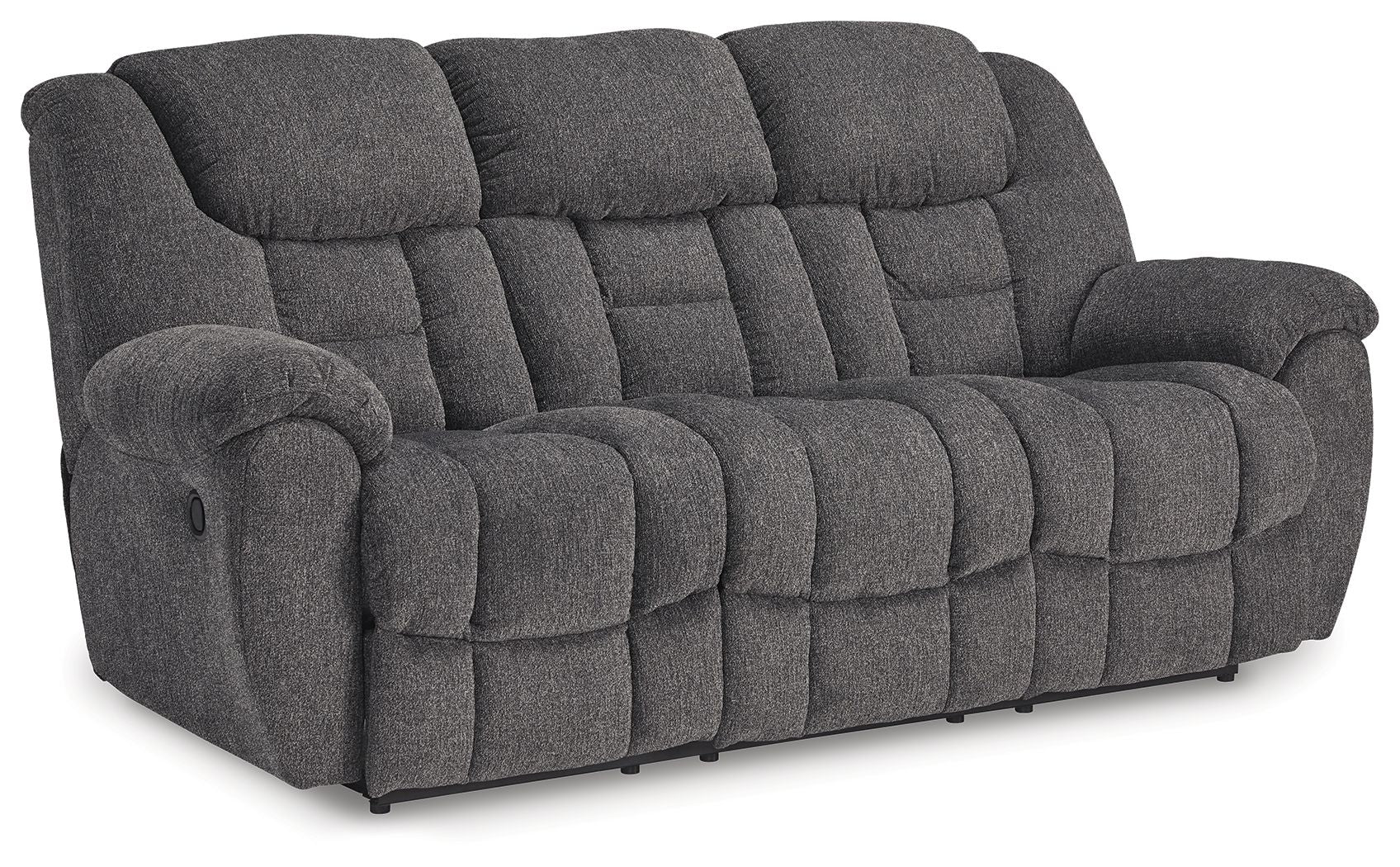 Dark gray reclining sofa with tufted back and padded arms, deep cushioned seat