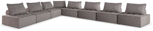 Outdoor sectional seating, dark gray fabric, multiple seat and back cushions