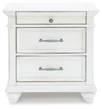 Whitewashed nightstand with two visible drawers, silver handles, and paneling