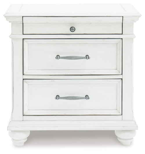Whitewashed nightstand with two visible drawers, silver handles, and paneling