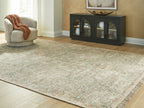 Rossbury rug, light beige ground with green and rust speckles, fringed border