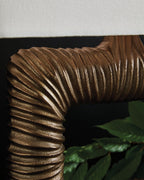 Antique brass ribbed metal lamp frame detail