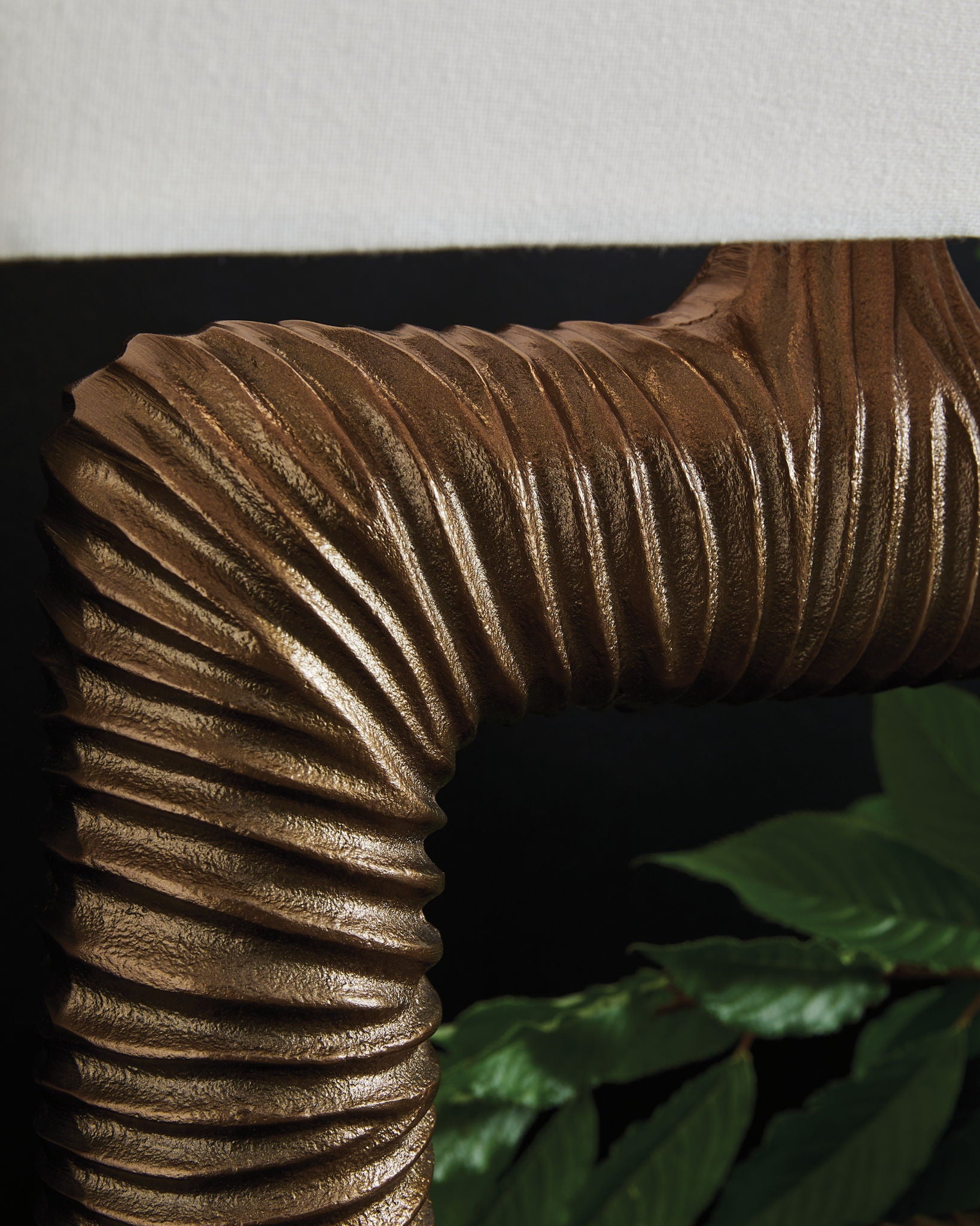 Antique brass ribbed metal lamp frame detail