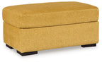 Keerwick upholstered ottoman in sunflower yellow with cushioned top and black feet