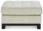 Beige oversized accent ottoman with tufted top and dark wooden legs