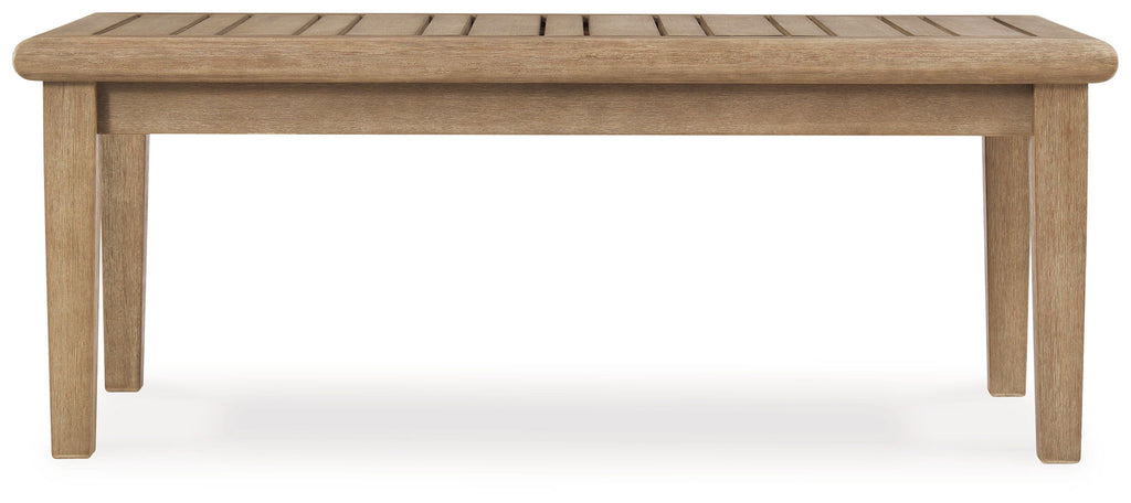 Rectangular cocktail table with beige wood top and straight four-leg base.