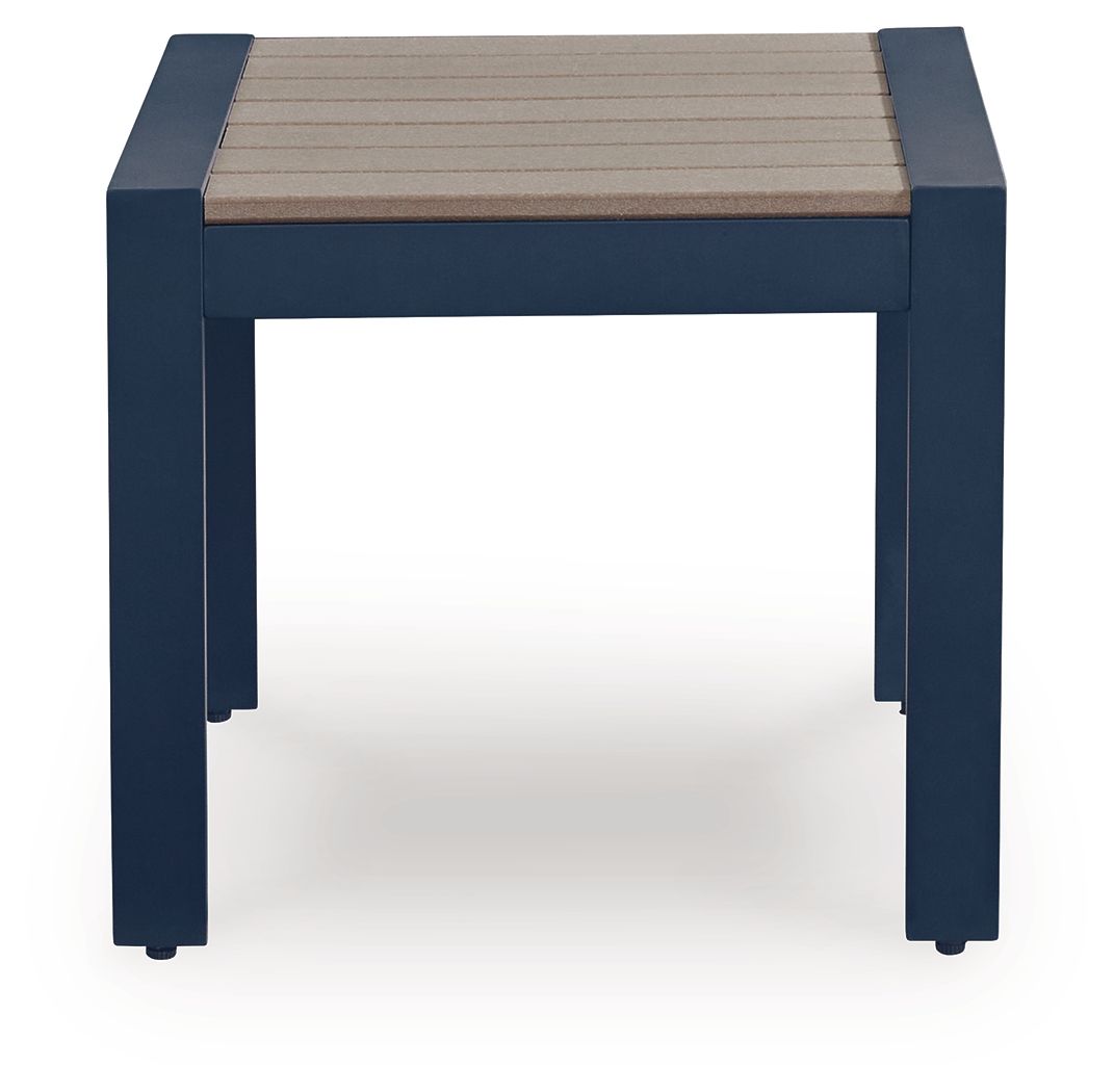 Blue rectangular cocktail table with slatted beige tabletop and four straight legs