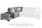 Gray left-arm facing corner chaise with back cushion, side arm, and folded throw