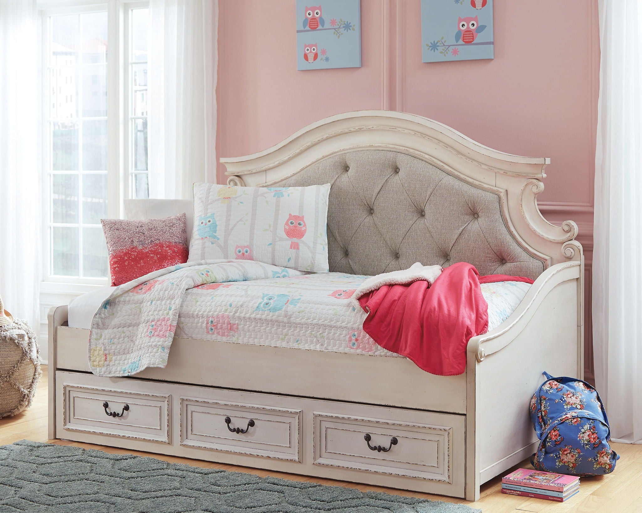 Twin day bed with storage in chipped white, tufted beige headboard, paneled drawers