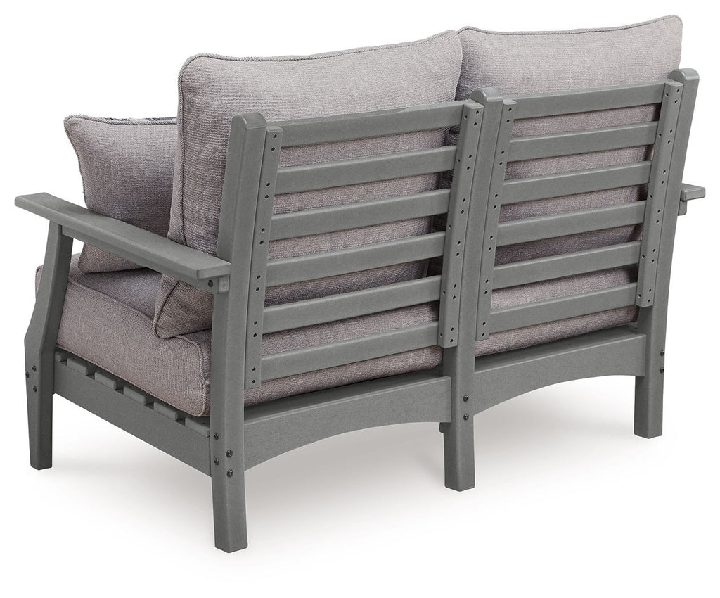 Gray loveseat with cushioned backrest and slatted frame, seat cushions visible