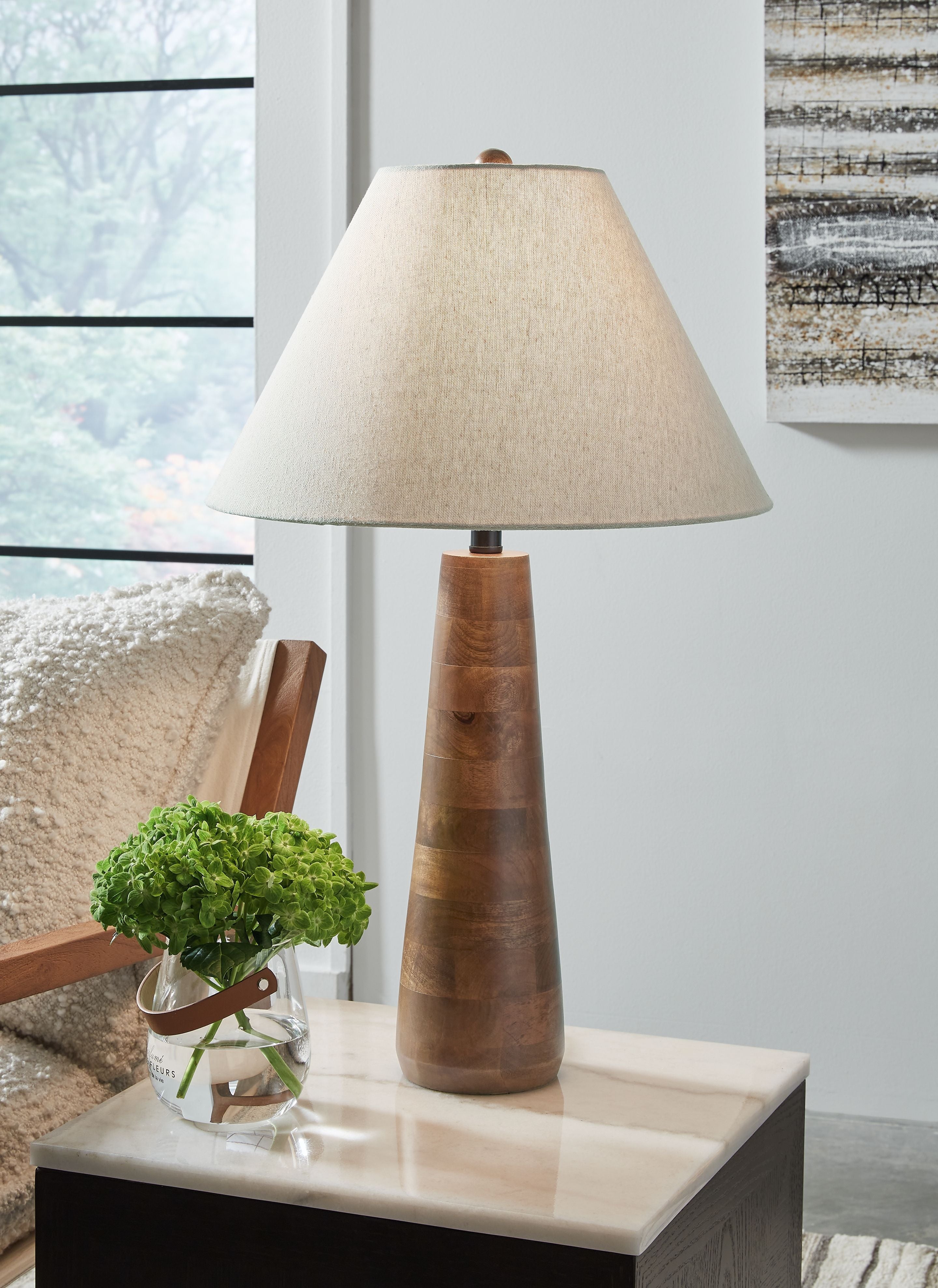 Floor lamp with off-white fabric shade and dark brown tapered wood base