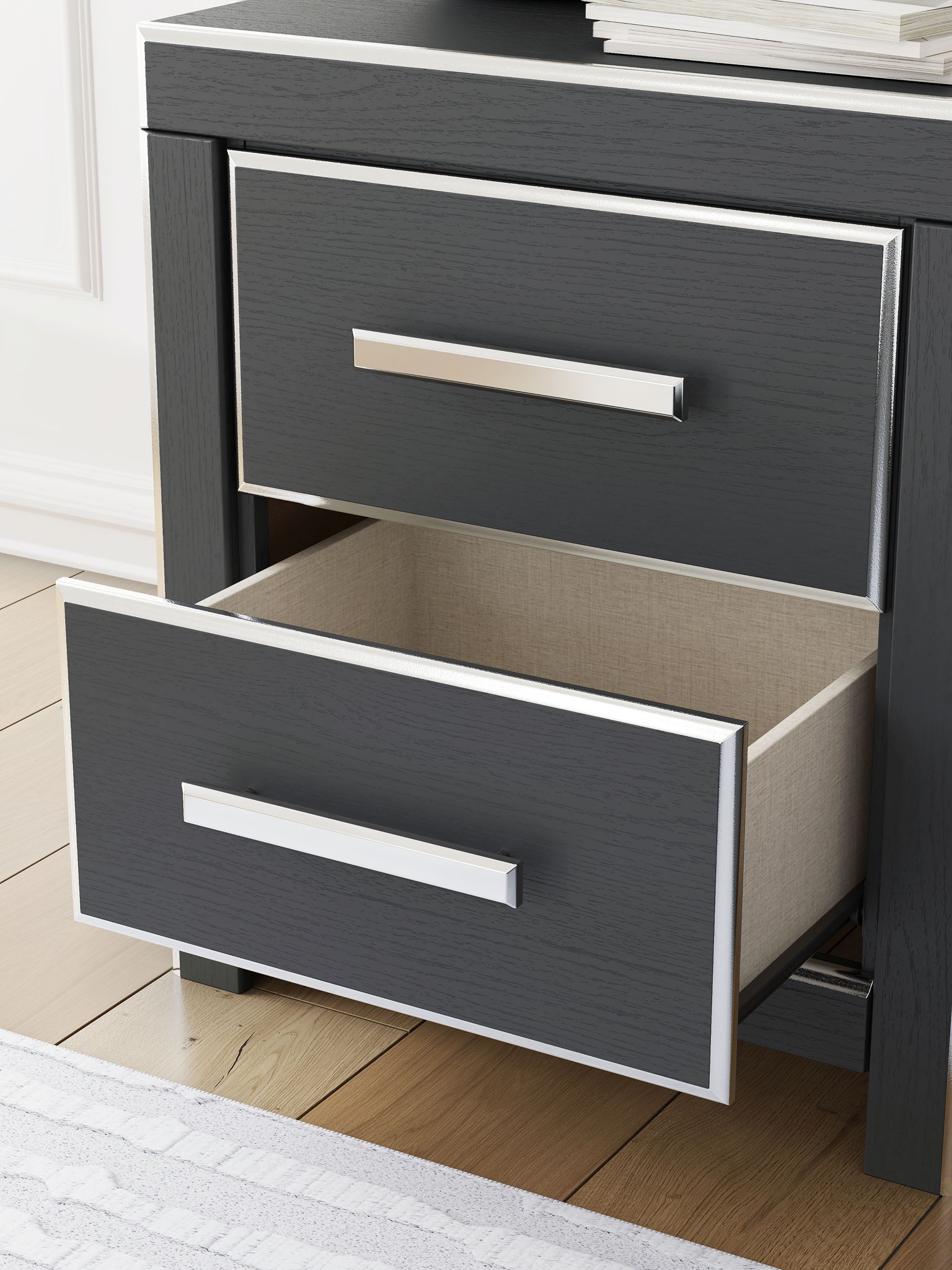 Black two-drawer night stand with two silver bar handles and open top drawer