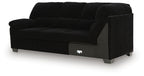 Black sofa with corner wedge, squared track arms, tufted seat and back