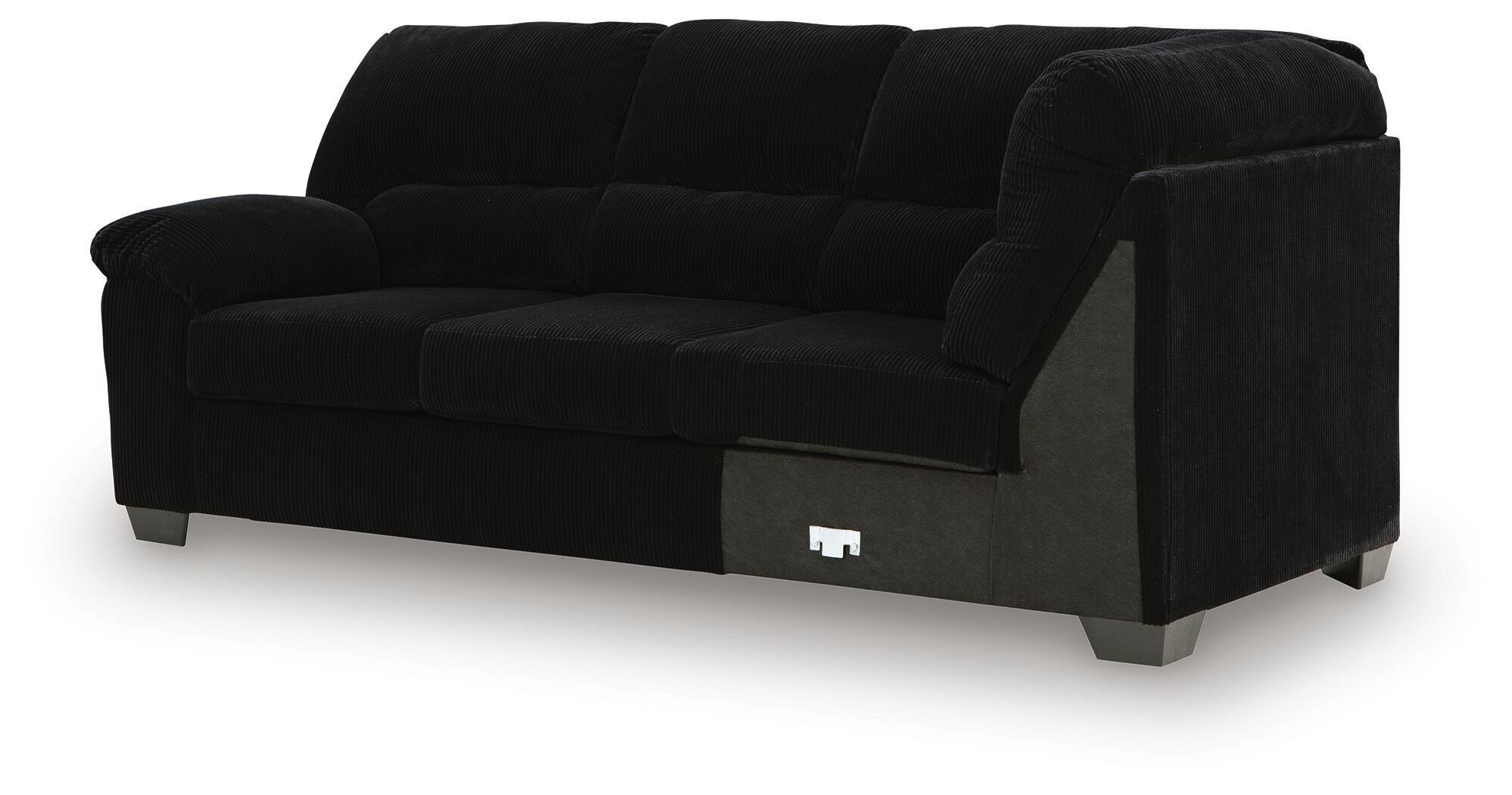 Black sofa with corner wedge, squared track arms, tufted seat and back