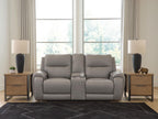 Gray power reclining loveseat with padded arms and recliner seats, front view