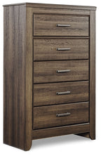 Juararo five-drawer chest in dark brown, angled front view with silver handles