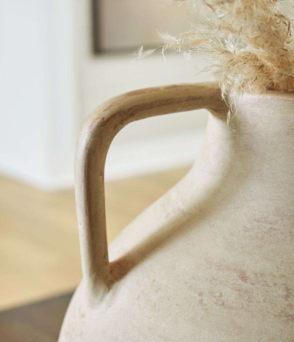 Beige ceramic vase handle with textured finish and open cutout