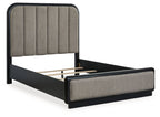 Dark gray upholstered panel bed with slatted support and black frame legs